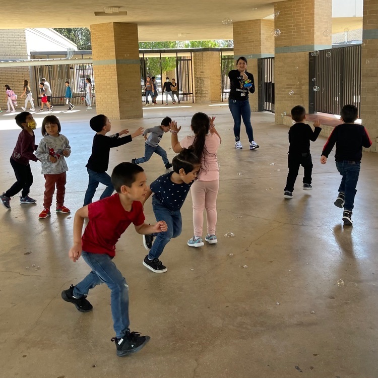 students playing with bubbles 